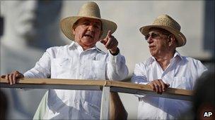 Cuba's President Raul Castro, left, wearing a guayabera shirt, speaking to Vice-President Jose Ramon Machado Ventura, Havana, May 2010