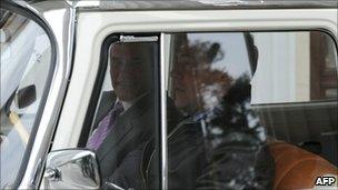 Russian President Dmitry Medvedev (r) and California Governor Arnold Schwarzenegger take a ride in a Soviet built Chaika luxury car