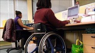 Person in a wheelchair using a computer