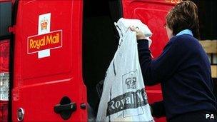 Postal worker collecting mail