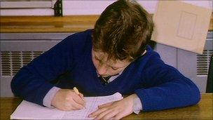 Child writing at desk