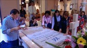 Pilgrims praying at the tomb of Sister Mary MacKillop