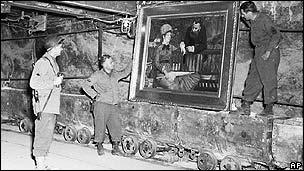 US soldiers with a Manet painting found in a German vault in April 1945