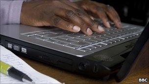 Woman typing on laptop