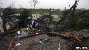 A family salvages their belongings after Typhoon Megi hits Ilagan City in Isabela province (18 October 2010)