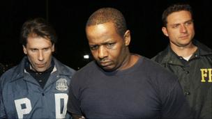 James Cromitie, centre, is led by police officers from a federal building in New York