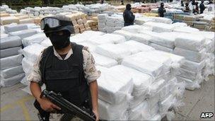 Members of the security forces guard confiscated marijuana in Tijuana, 18 October 2010