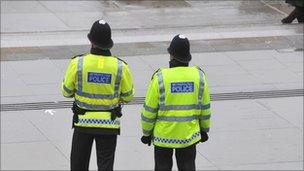 Police officers, pictured from behind