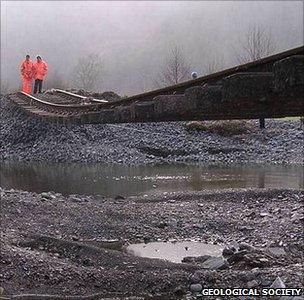 Rail engineers inspect a damaged rail line (Image: RGS)