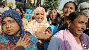 A funeral for victims of the market attack in Karachi on 20 October 2010