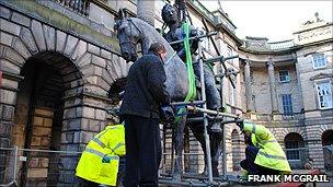 The statue being removed from its plinth (Pic by Frank McGrail)