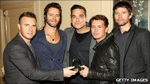 Take That with their award