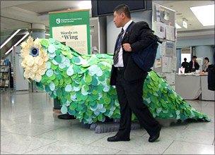 Man and bird sculpture at CBD conference