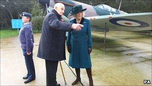 The Duchess of Cornwall talks to William Walker, 97, the oldest survivor of the Battle of Britain in front of a Spitfire