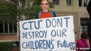 A man holds a poster supporting the Hobbit movies in Wellington on 25 October 2010