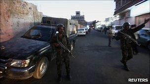 Yemeni security forces block a street in the capital Sanaa, 30 October