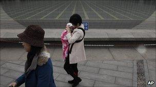 Woman with child in Beijing