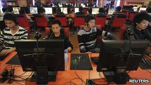 Computer users in an internet cafe