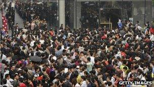 People queue for the launch of the iPhone