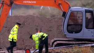 The scene at Waterfoot, County Antrim, as the remains of Peter Wilson are recovered