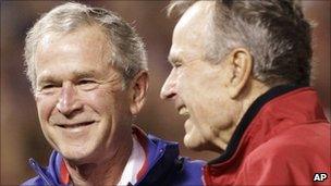 George W Bush and his father, former US President George Bush at a baseball match on 31 October 2010