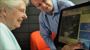 Elderly person using touchscreen computer