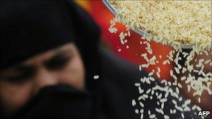 A woman receives subsidised rice in Bangladesh