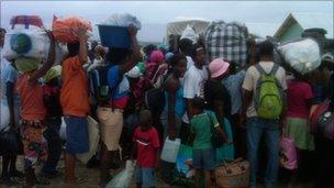 People getting ready to leave a camp in Corail in Haiti