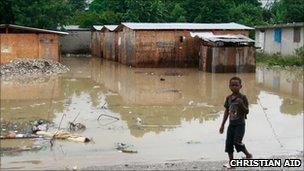 Boy near a flooded area in Leogane, Haiti (photo: Christian Aid/Susan Barry)