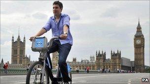 A man rides a cycle hire bike