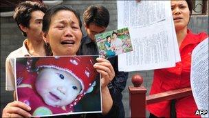 A grieving woman protests outside the Ministry of Health in Beijing. File photo