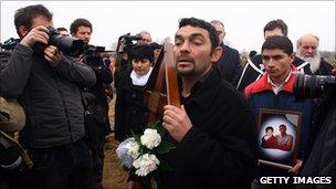 Mourners at the funeral of Robert Csorba and his son, killed in an attack in 2009