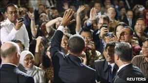 US President Barack Obama greets members of the audience after delivering a speech at the University of Indonesia