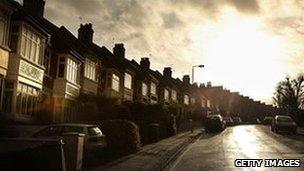 Houses under a dark sky