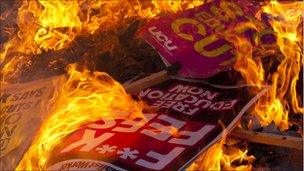 Placards burning. Photo: Jason Curtis