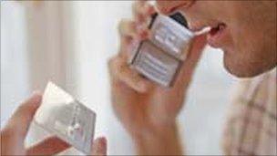 Man reads credit card details into telephone