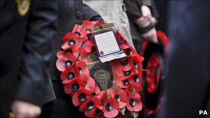 Man holding Royal British Legion wreath