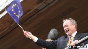 Sir Terry Matthews waves the European flag at the Ryder Cup