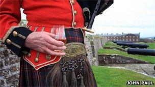 Piper at Fort George holding a glass of the single malt. Image: John Paul