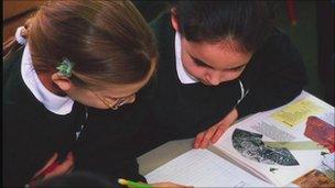 Girls studying in classroom