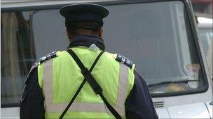 Traffic warden issuing fine