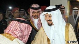 Crown Prince Sultan bin Abdul Aziz is greeted by officials at King Khalid airport in Riyadh