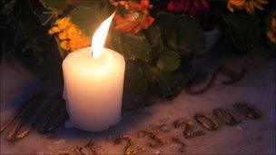 Candle on grave of a victim of the Maguindanao massacre, picture taken November 2010