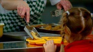 Pupil is served a school dinner