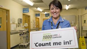 Nurse holding placard