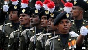 Sri Lankan soldiers march during a military parade in Colombo on 19 November , 2010