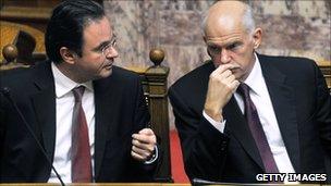 Greek Finance Minister George Papaconstantinou [L] with Prime Minister George Papandreou in parliament (18 Nov 2010)