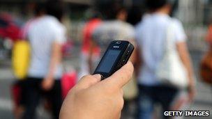 A person sending a text message