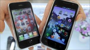 An iPhone and Samsung Galaxy smartphone