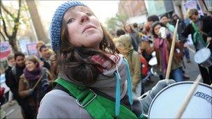 A student banging a drum earlier in the day